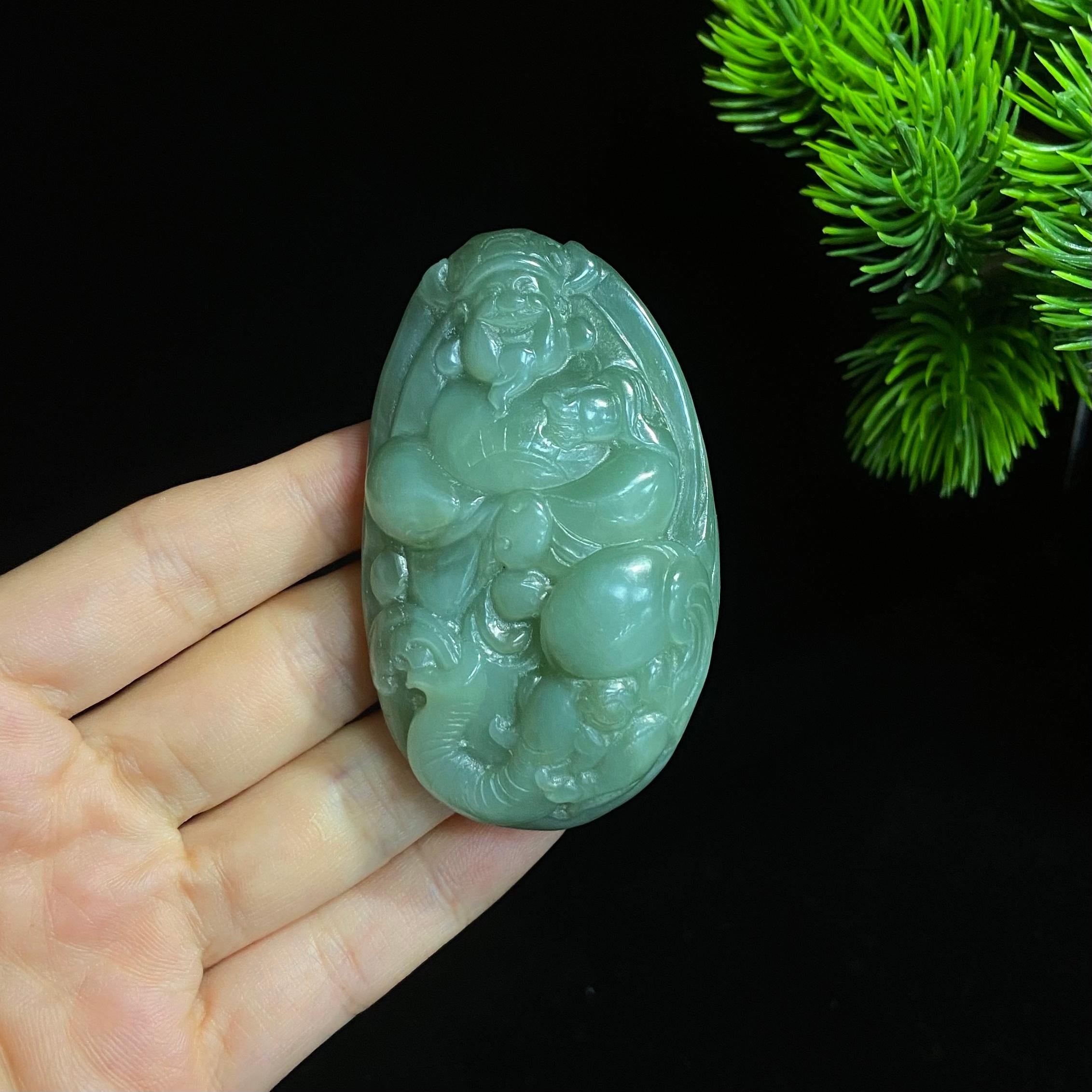 和田碧玉猫眼财神大手把件（77.0g）