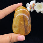 和田玉聚黄皮籽料手把件（87.2g）