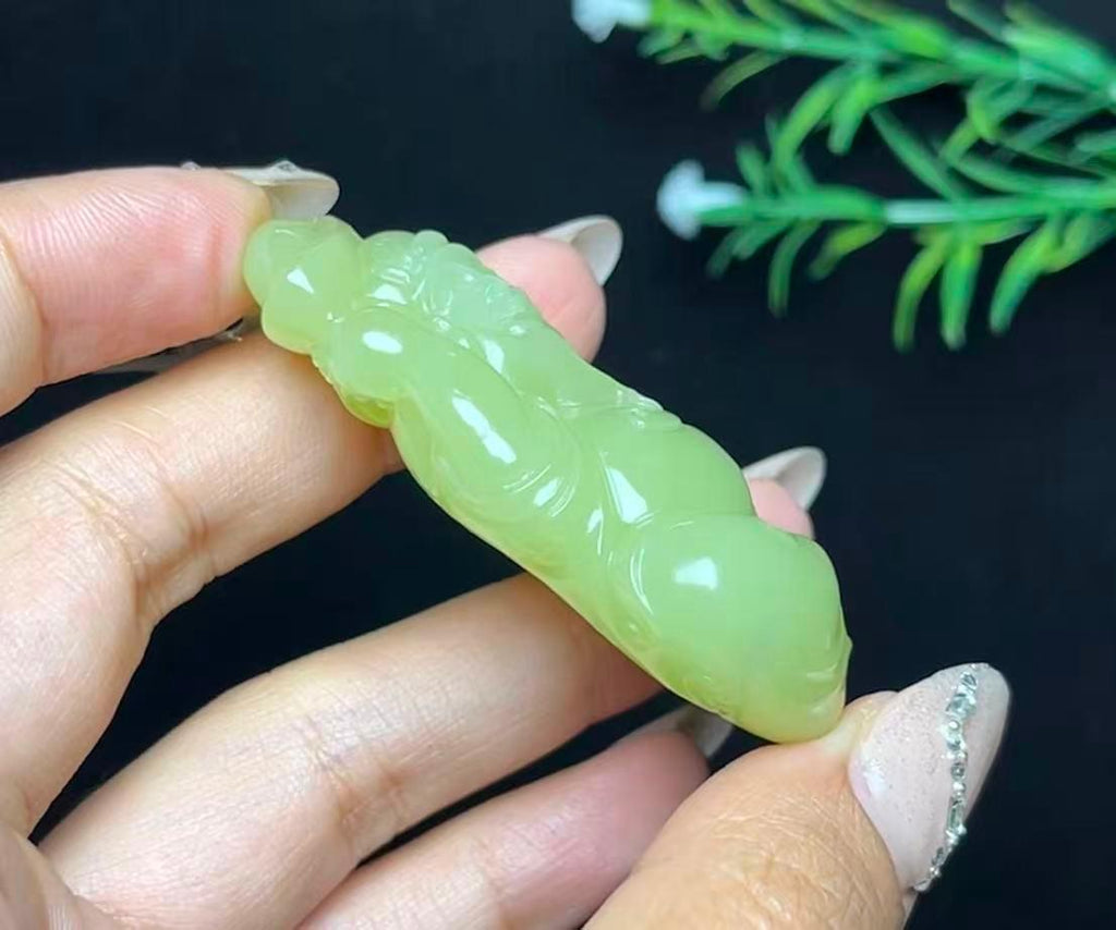 和田玉若羌黄口料财神（44.3g）