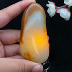 和田玉聚黄皮籽料手把件（75g）