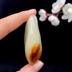 和田玉-聚黄皮带洒金皮白肉籽料原石（70.7克）