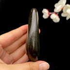 和田玉-沙枣青聚黑皮籽料原石（161.7克）