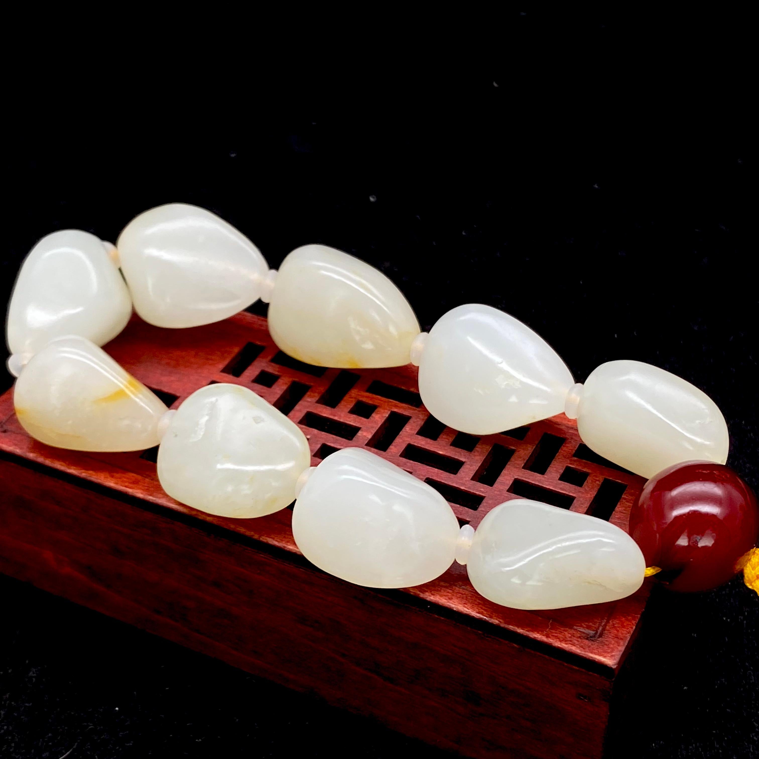 和田玉 和田玉聚红皮籽料原石（4.8g） – 厚德载玉