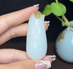 新疆和田玉且末糖白羊脂玉站观音（34.3g）