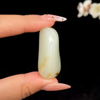 和田玉白玉带黄皮籽料挂件（38.8g）