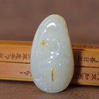 和田玉籽料洒金皮白玉龙形雕刻件（48.6g）