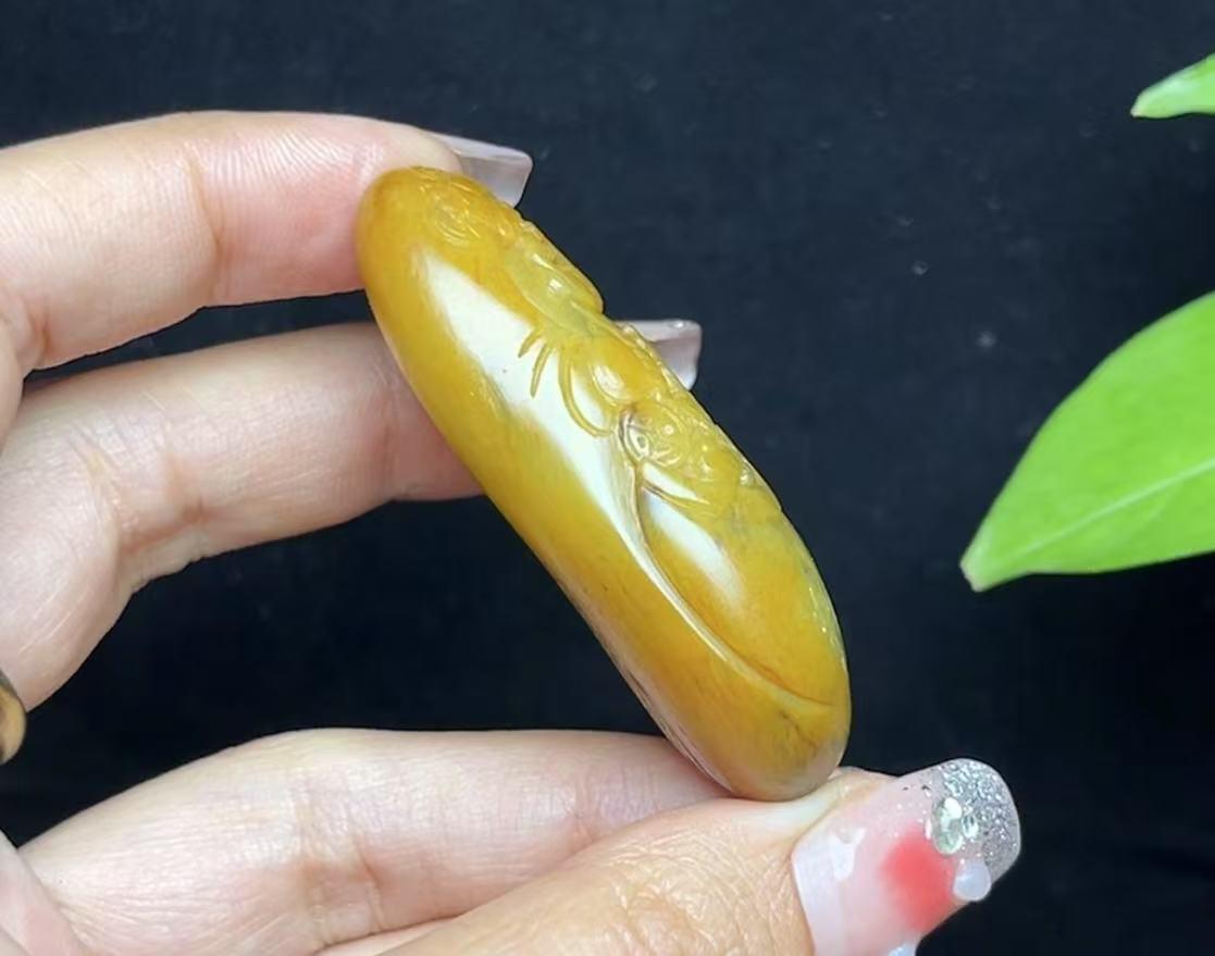 新疆和田玉籽料红沁财神（53.3g）