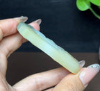 新疆和田玉且末糖白羊脂玉带翠文殊菩萨（59.3g）