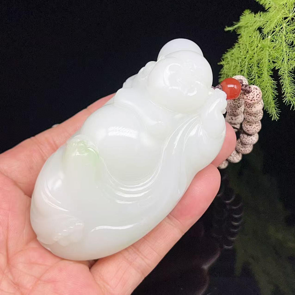 和田玉羊脂白玉带翠弥勒佛手把件（249.0g）