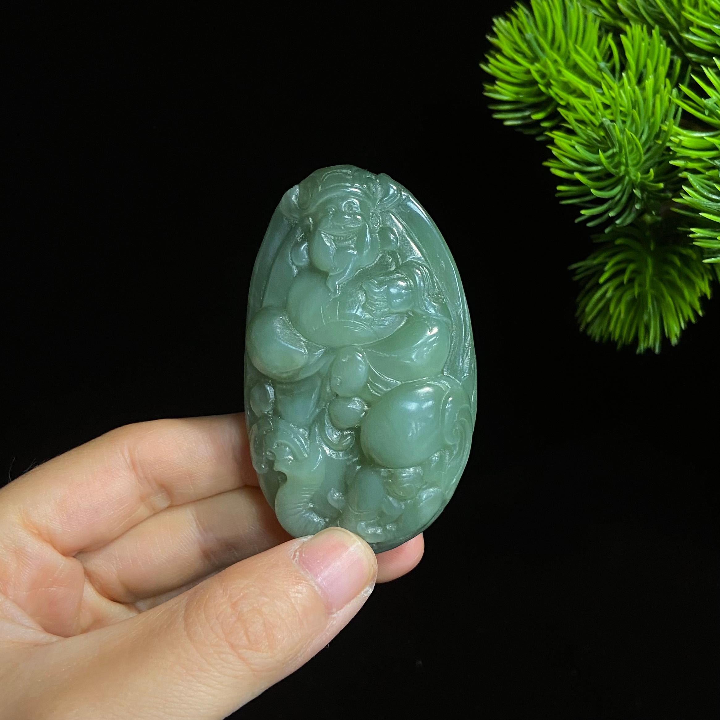 和田碧玉猫眼财神大手把件（77.0g）