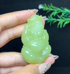和田玉若羌黄口料财神（44.3g）