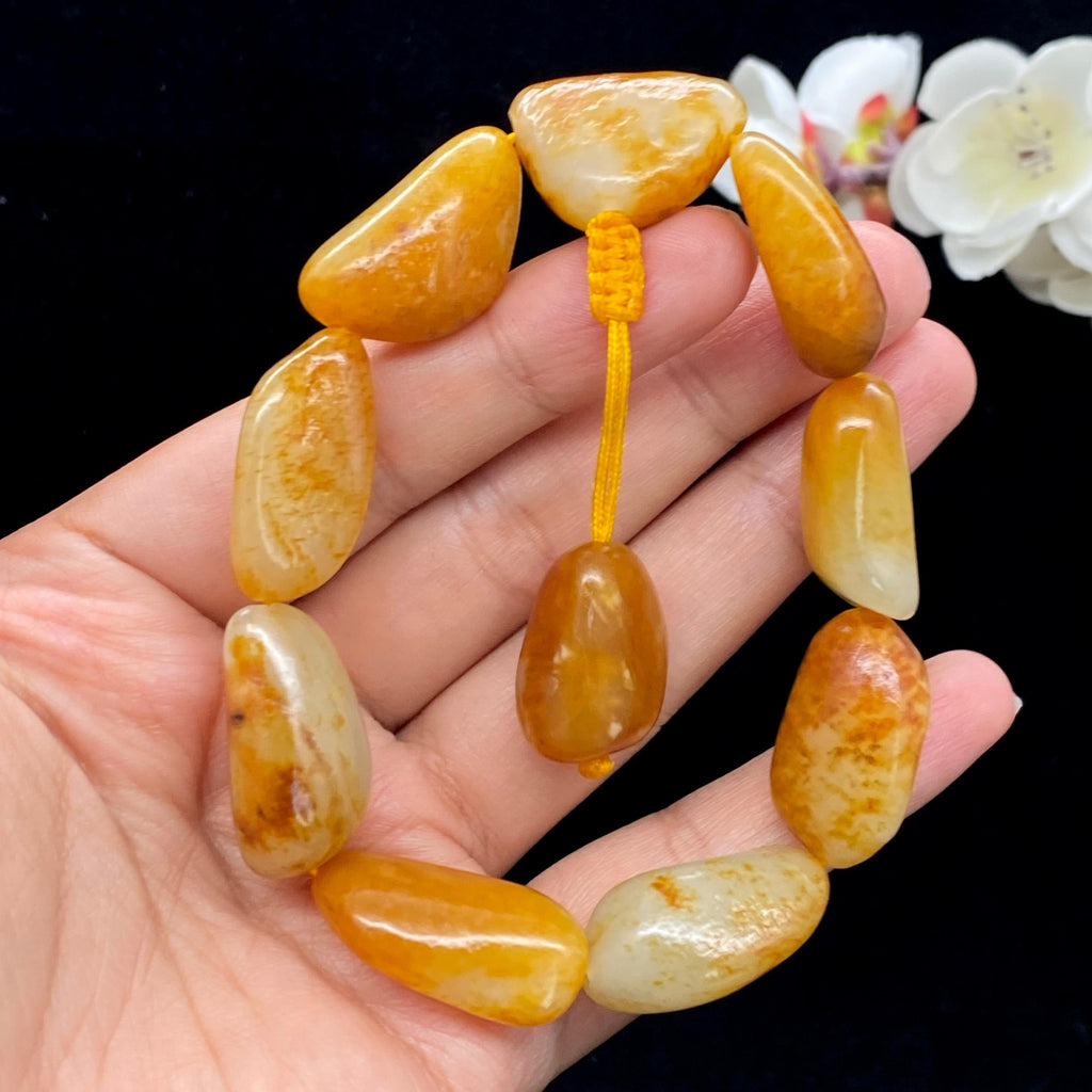 和田玉聚黄皮籽料【精品手串】（63.6g）