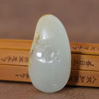 和田玉籽料洒金皮白玉龙形雕刻件（48.6g）