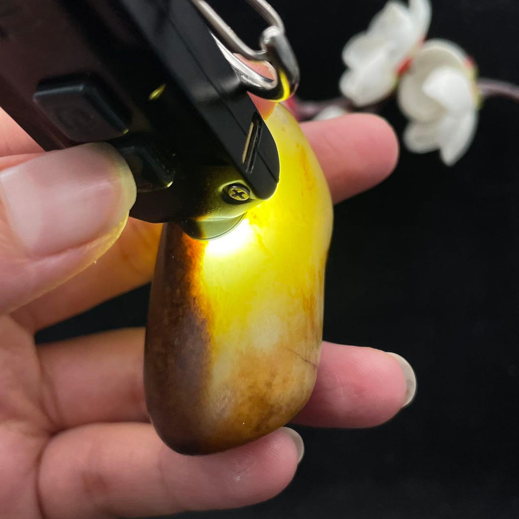 和田玉聚黄皮籽料手把件（61.4g）