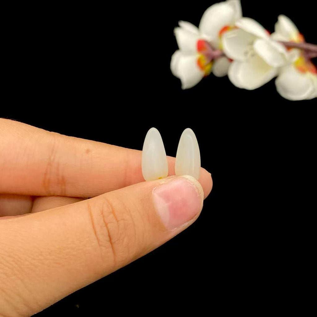 和田玉聚黄皮籽料戒面籽（1.7g）