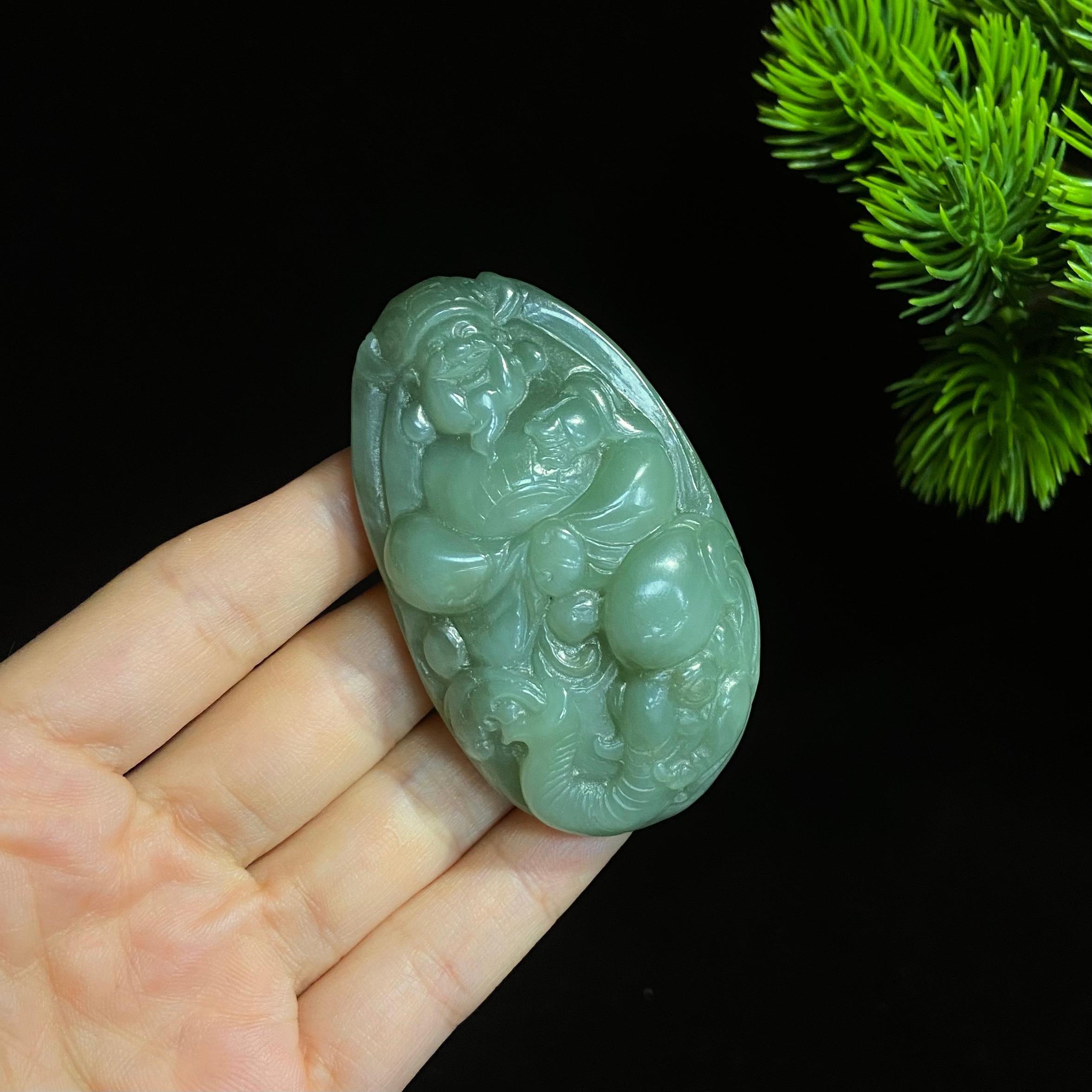 和田碧玉猫眼财神大手把件（77.0g）