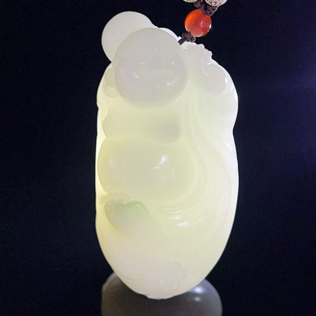和田玉羊脂白玉带翠弥勒佛手把件（249.0g）
