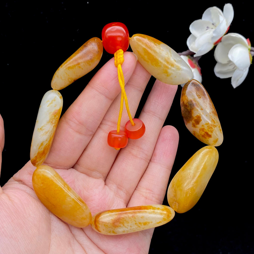 和田玉洒红皮籽料【精品手串】（77.5g）