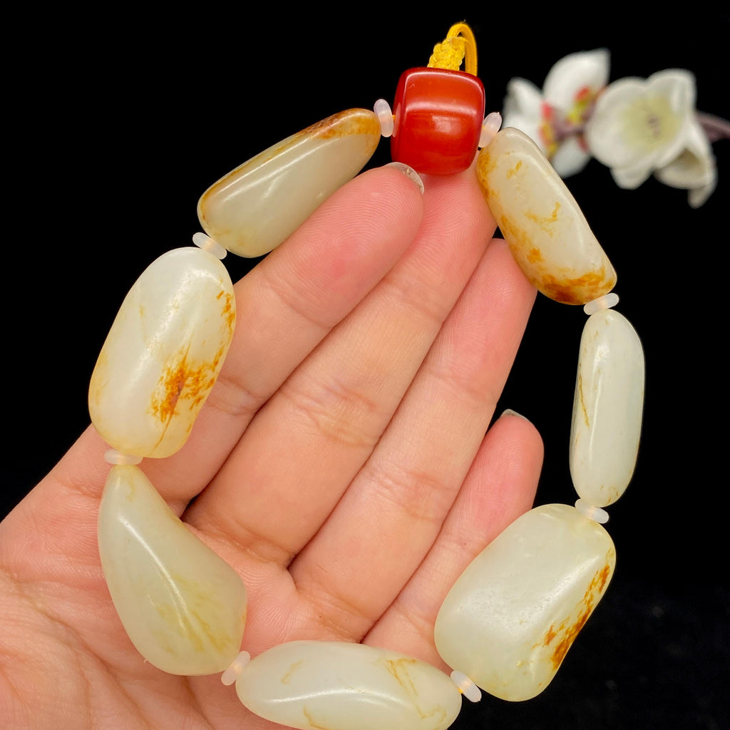 和田玉洒红皮籽料【精品手串】（68g）
