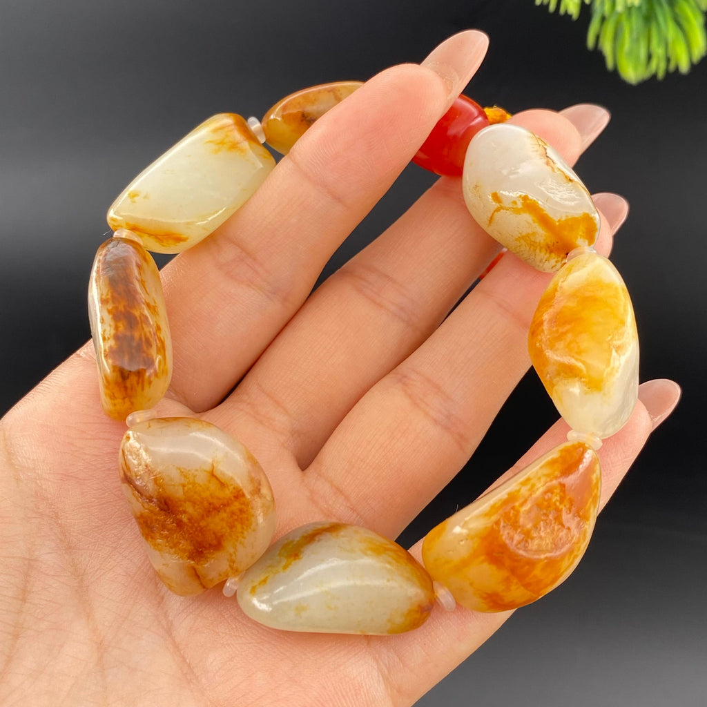 和田玉洒红皮籽料手串（71.15g）