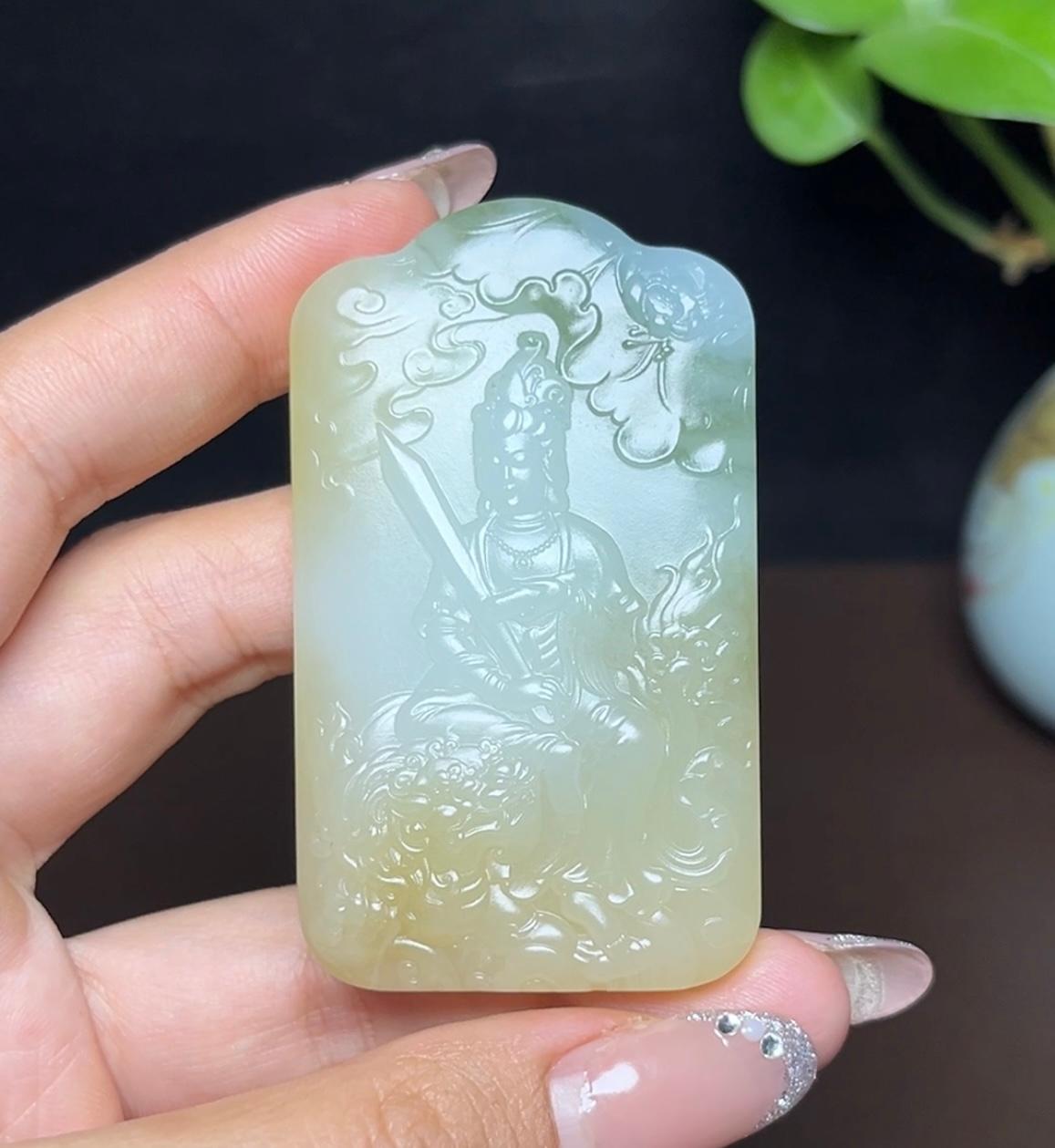 新疆和田玉且末糖白羊脂玉带翠文殊菩萨（59.3g）